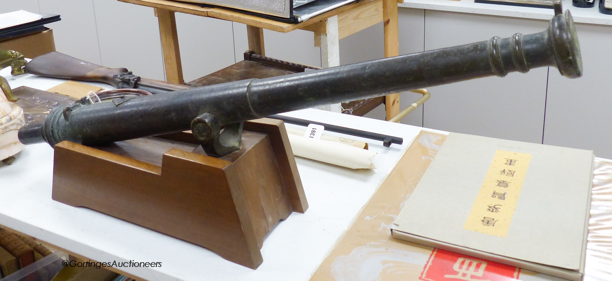 An 18th century Lantaka bronze swivel cannon, 101cm long, on a later wood stand